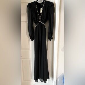 Marciano black gown with gold chain detail. Cut outs on the waist.